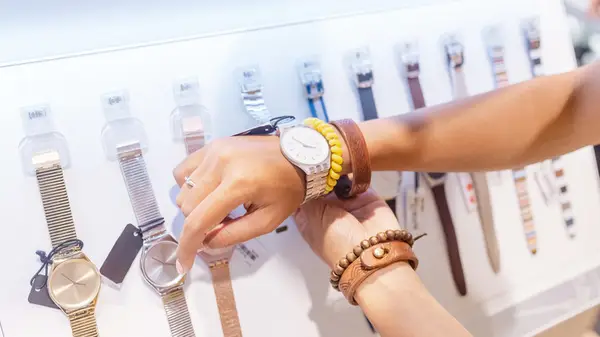 trying on classic watches