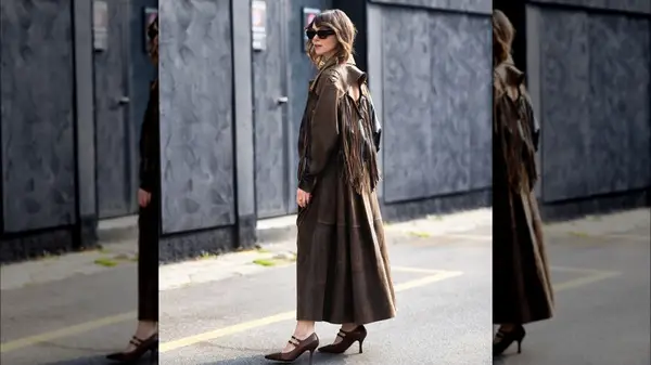 Woman in a tassel coat 