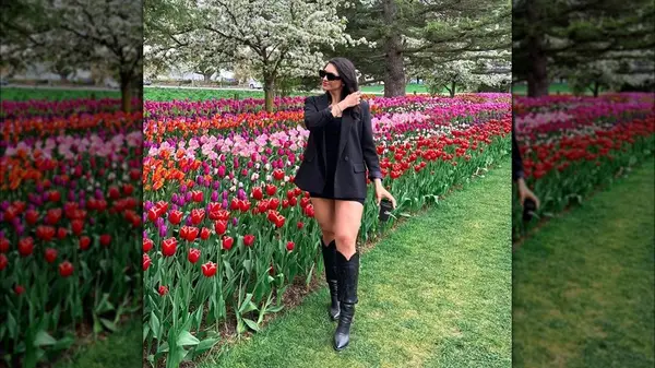 Woman in black cowboy boots