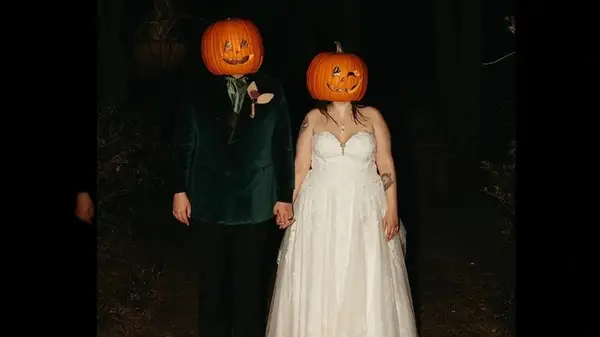 couple wearing wedding halloween costumes
