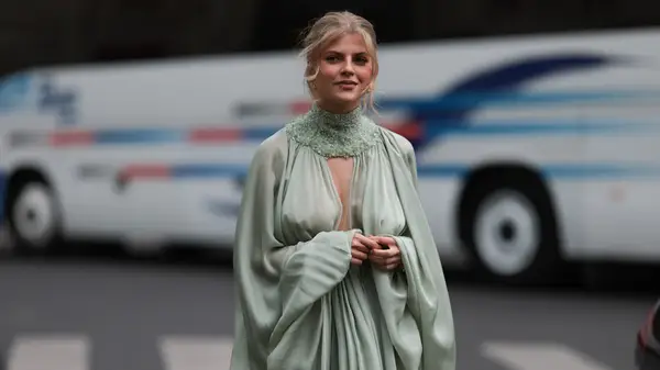 Woman in green dress with cutouts 