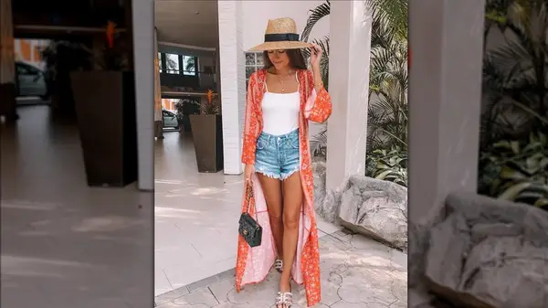 Caitlin Covington in a kimono and jean shorts