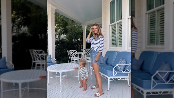 A woman on a porch with her daughter