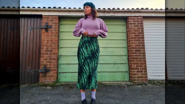 Woman in patterned green skirt