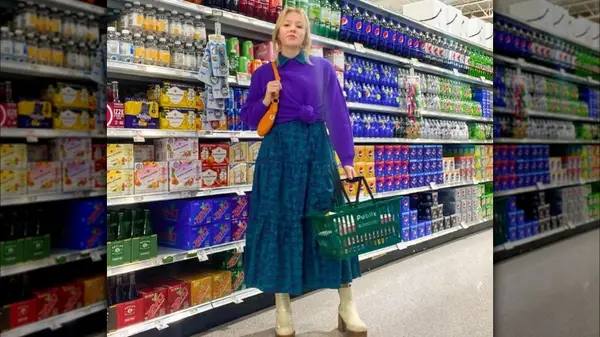Woman modeling blue-green dress