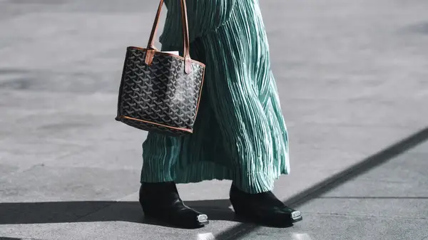 Woman wearing black square-toed boots