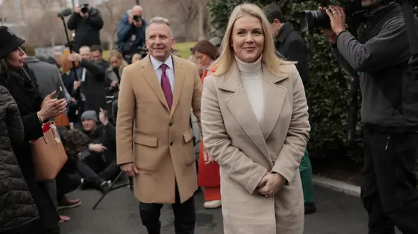 karoline leavitt in a cream coat