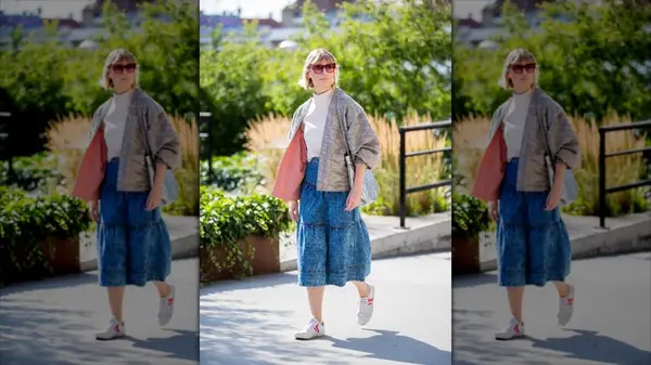 Woman wearing denim midi skirt and white sneakers