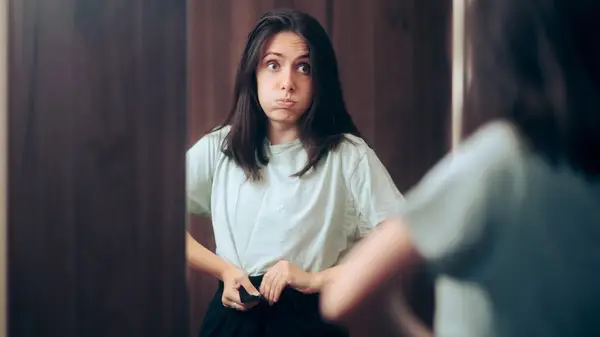 Woman in uncomfortable pants