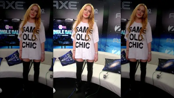Lindsay Lohan in an oversized white tee that says 