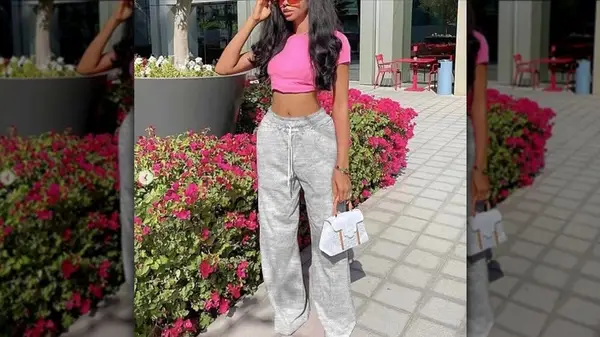 Woman wearing sweats and crop top