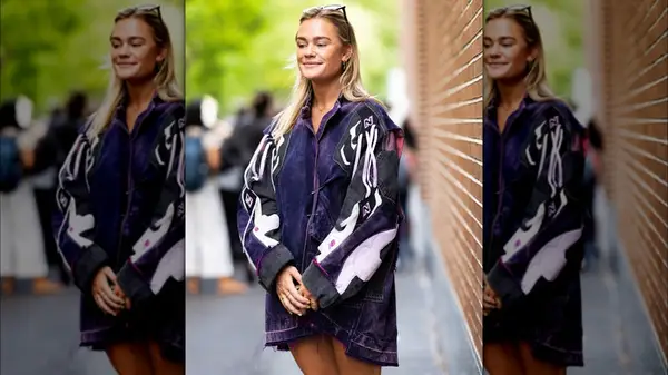 A woman wearing a purple denim jacket 