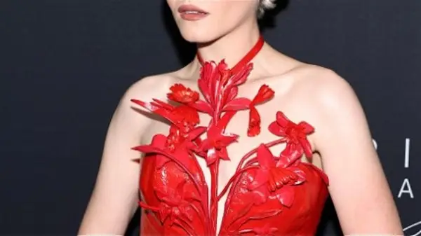 Julia Garner in red halter top