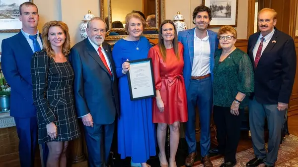 Sarah Huckabee Sanders wears red dress