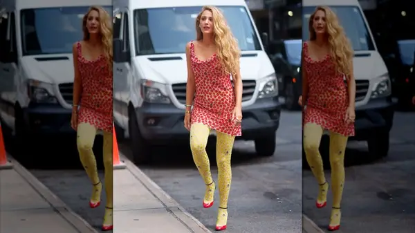 Blake Lively in New York City in a red mini dress with yellow tights