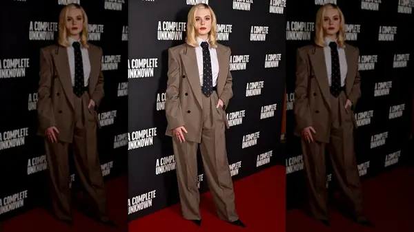 Elle Fanning dressed in a suit and tie at UK premiere of 