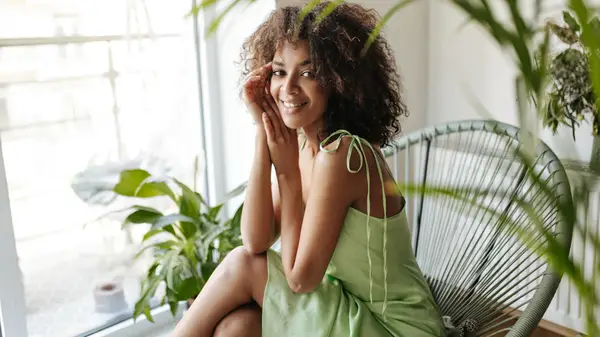 Woman wearing green silk dress