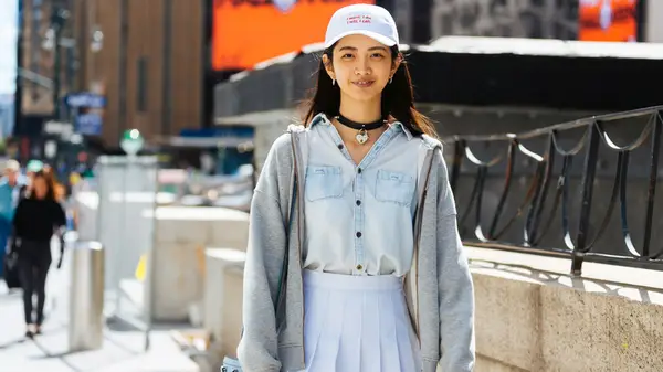 Model wearing chambray button up