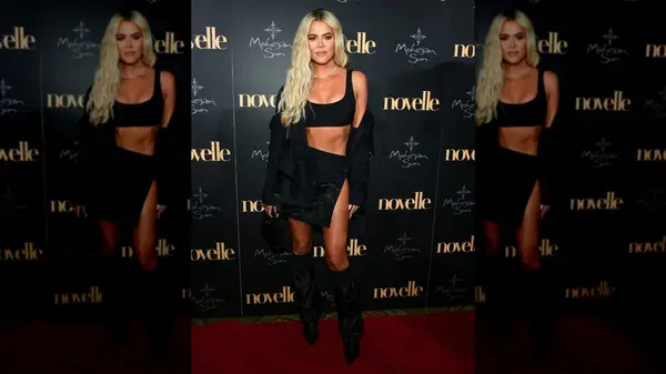 Khloe Kardashian wearing a black crop top and skirt in 2019