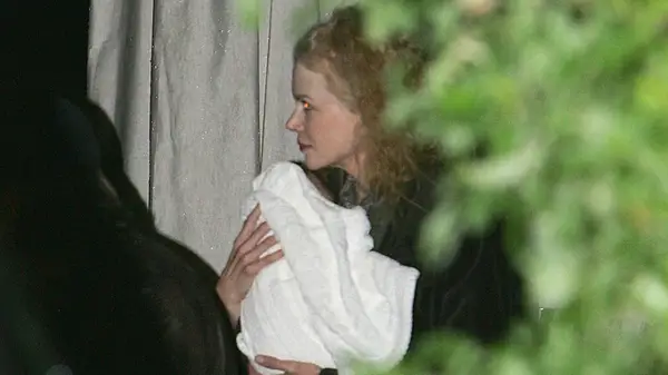 Nicole Kidman carrying Sunday Rose Kidman-Urban in 2008