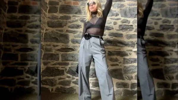 Roslyn Griner poses in front of a stone wall