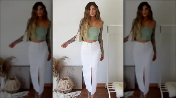 Woman posing in white denim skirt