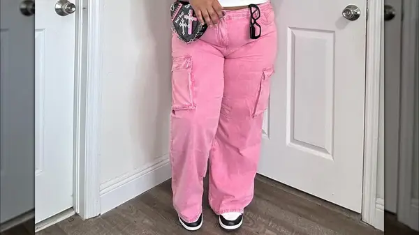 A woman in pink jeans