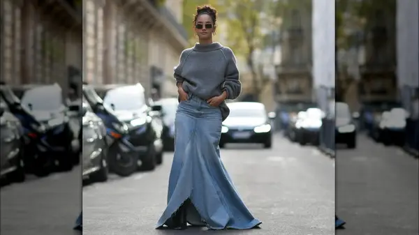 A woman in a denim handkerchief skirt 