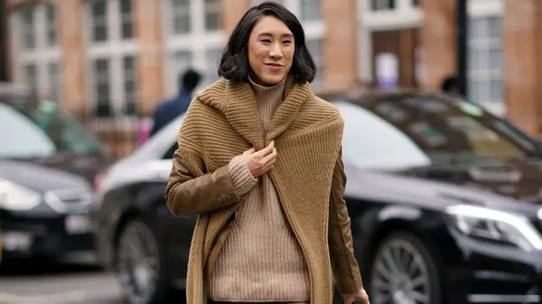 Woman in two sweaters 