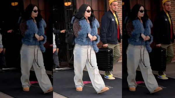 Paparazzi shot of Charli XCX wearing baggy jeans and Ugg boots