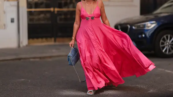 Woman in pink maxi dress