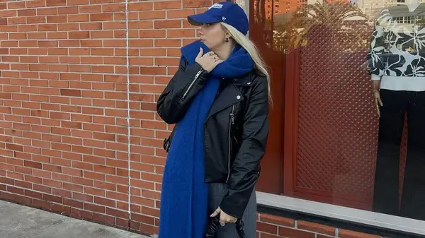 Woman wearing blanket scarf