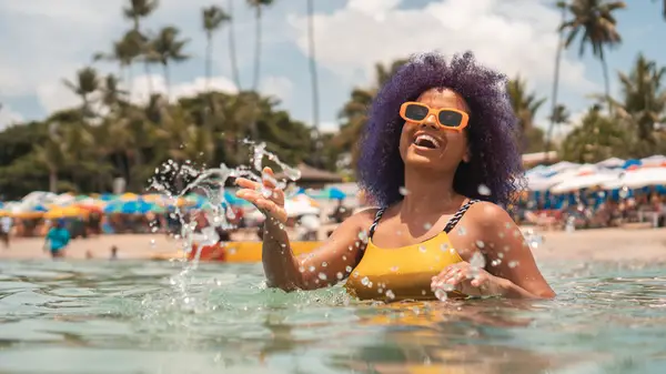 woman wearing sunglasses on beach