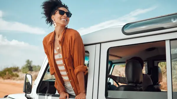 woman leaning out car window