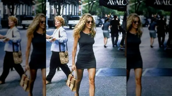 Carrie Bradshaw wearing gray dress