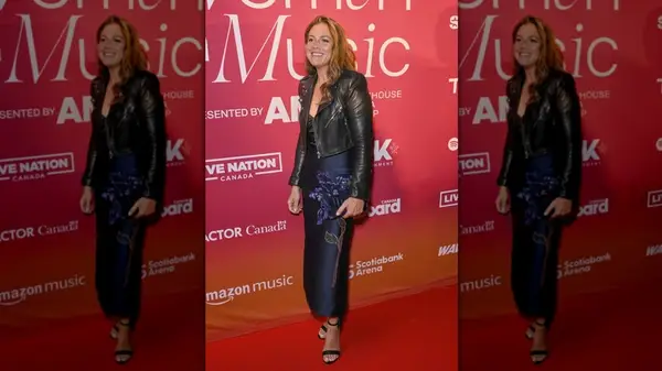 Sophie Grégoire wearing a blue midi dress and leather jacket at a 2024 event