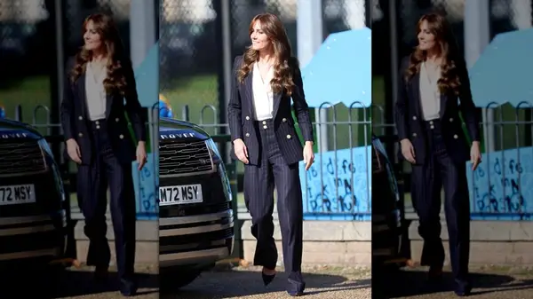 Kate Middleton in a navy pinstripe pantsuit in October 2023