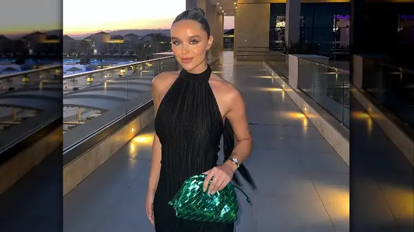 Woman with green metallic clutch