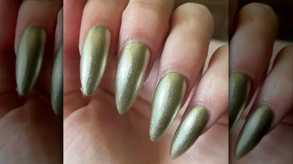 fingers with gold nail polish