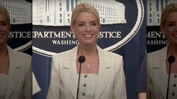Pam Bondi wearing a white pinstripe suit