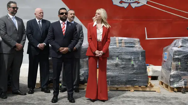 Pam Bondi wearing a flared red suit