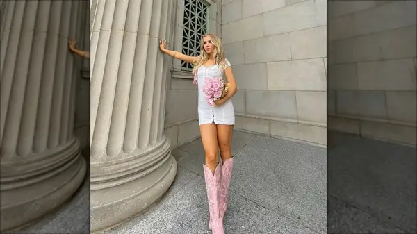 Woman in a dress and cowboy boots