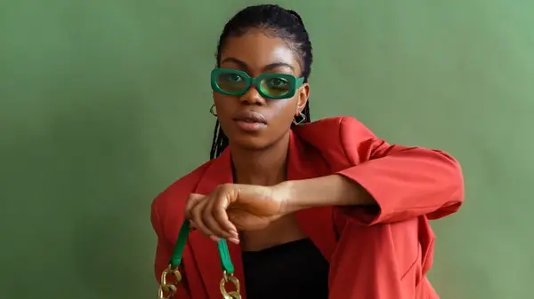 Woman wearing green sunglasses