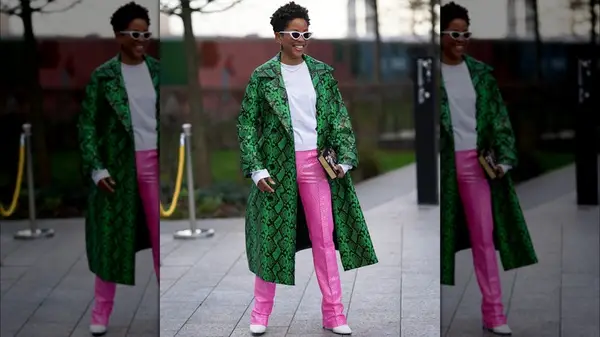 A woman in a snakeskin trench coat 