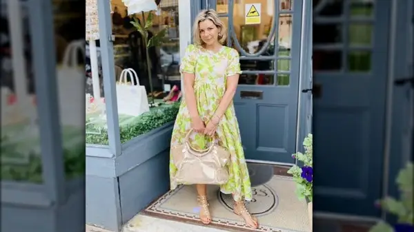 Woman in floral dress and gladiator sandals