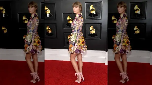 Taylor Swift wearing a floral mini dress on the red carpet