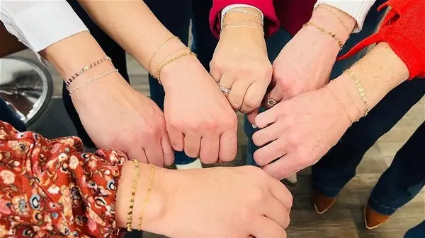 People wearing permanent bracelets