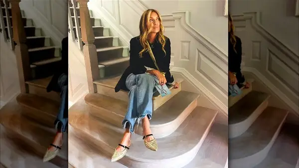 Model in distressed jeans and metallic mules