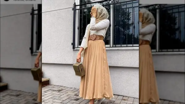 Woman posting hiding her face