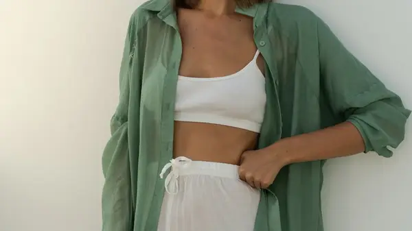 Green linen shirt, sports bra, pants